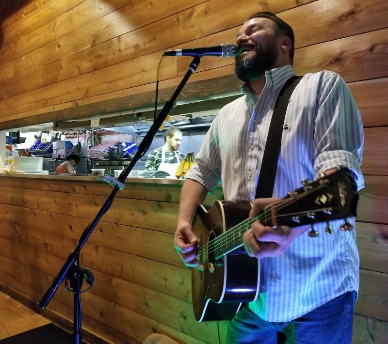 Anthony V. Carmen kept the event upbeat in spite of the rainy weather. BOB YESBEK PHOTOS